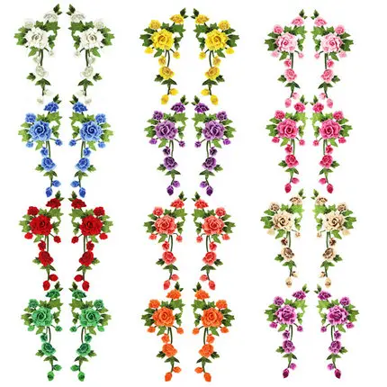 Embroidered fabric featuring a peony-colored floral pattern, with cut-out details, serving as stage clothing accessories. It includes water-soluble embroidered lace, hand-sewn brooches, and appliquéd embroidery.,2018-04-12 10:38:09